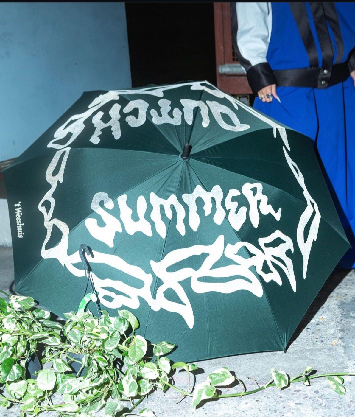 the dutch summer mark printed in white on a dark green umbrella